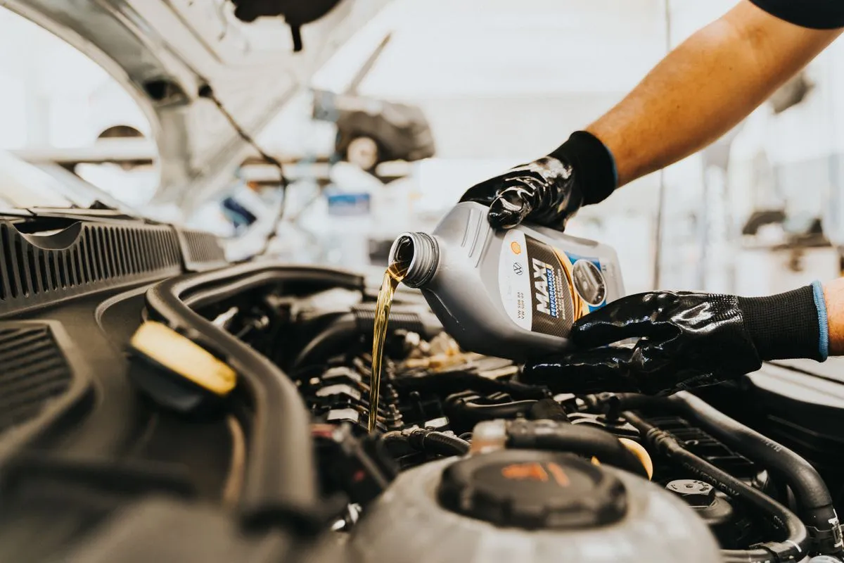 Fresh oil being poured during a service for a Bedworth customer