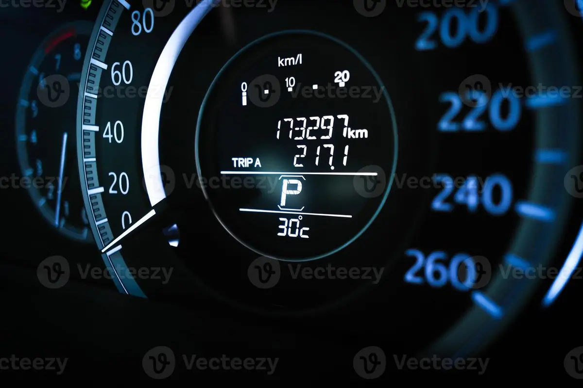 Close up of a car digital dashboard showing odometer reading